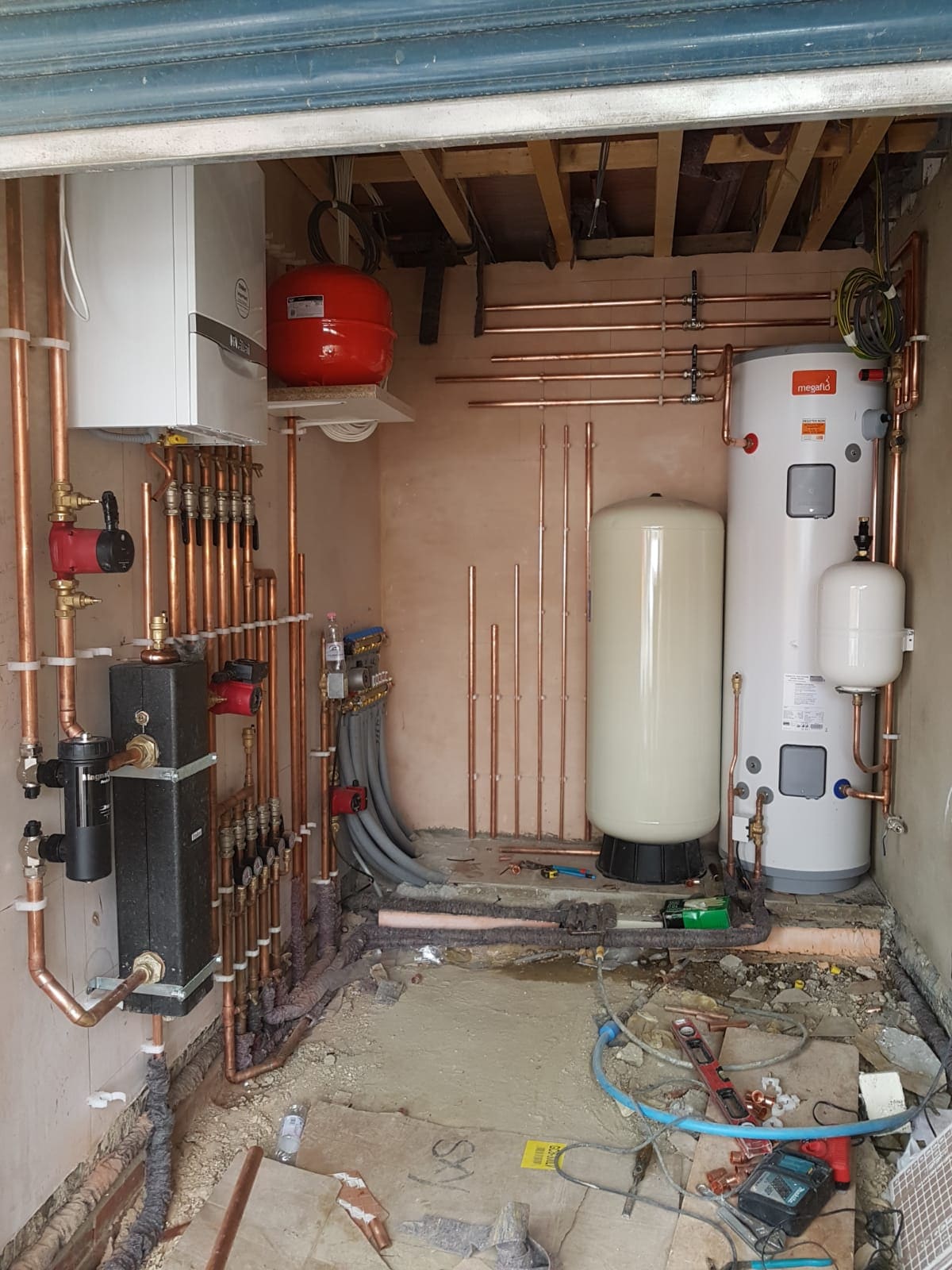 Megaflo unvented hot water cylinder and central heating installation by boiler and heating engineers at Kings Renovations