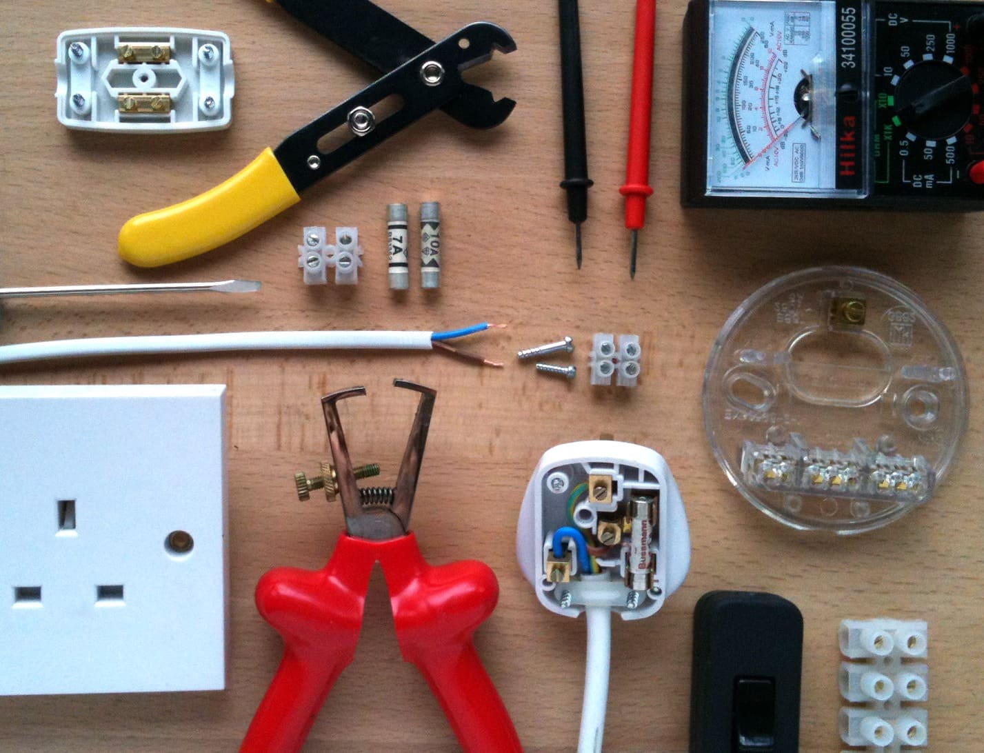 UK electrical tools, plug wiring, fuses and test meter — qualified electricians at Kings Renovations
