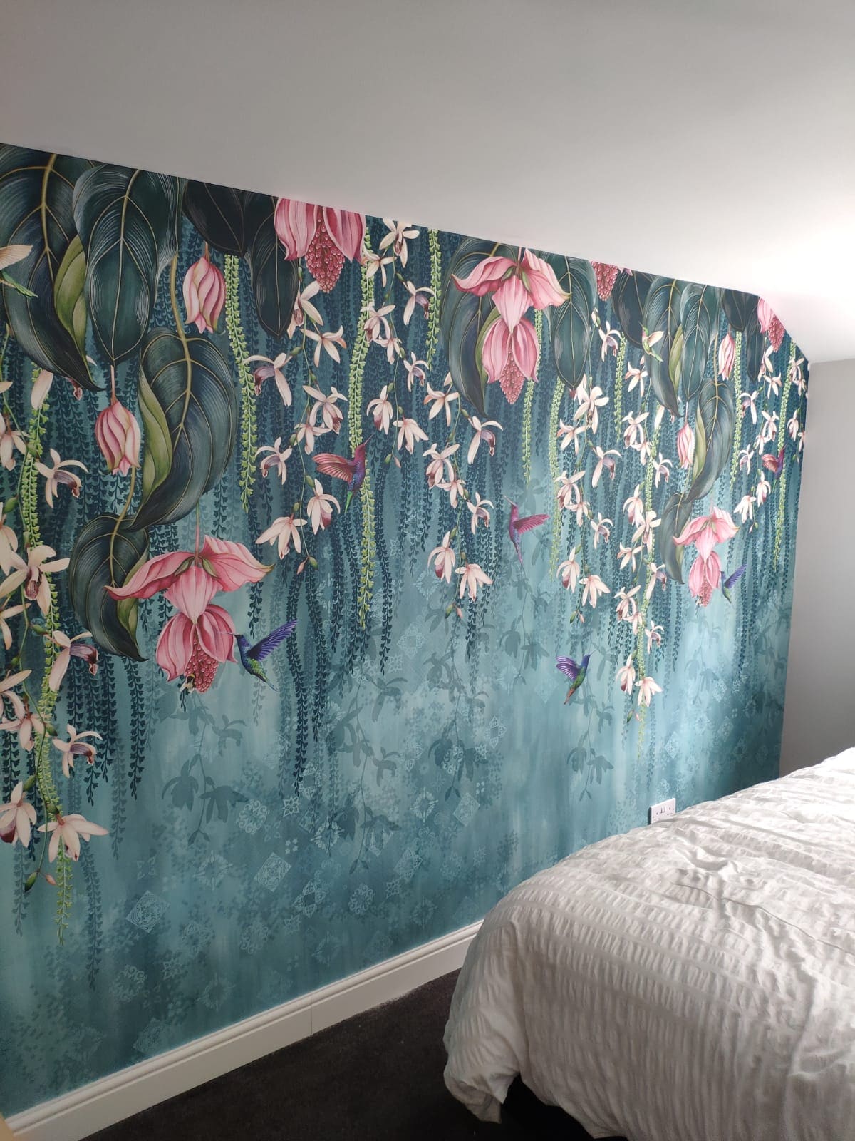 Floral feature wall wallpapering and decorating in a Hertfordshire bedroom
